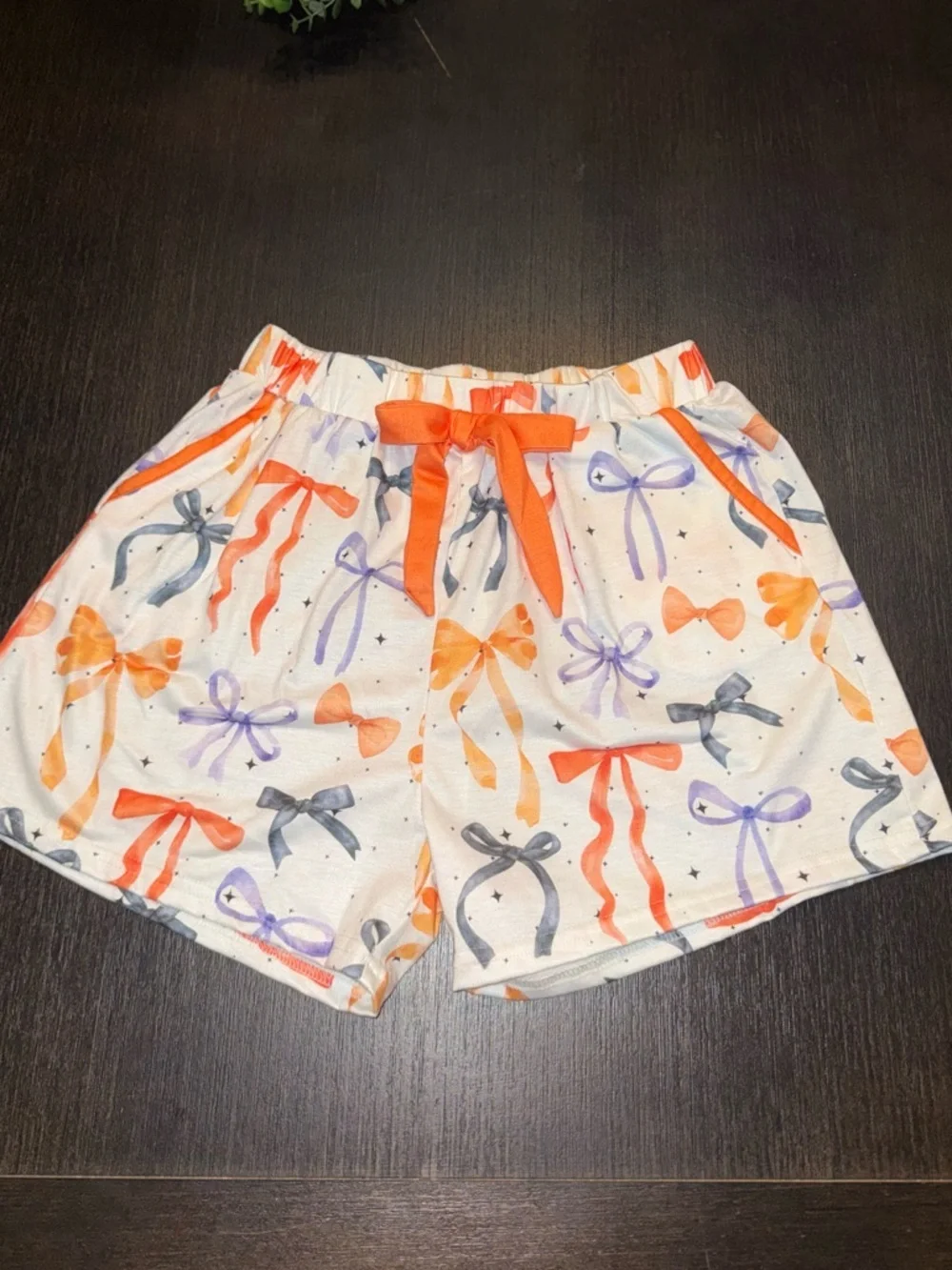 Primark White Elastic Waistband Shorts with Orange and Purple Star Print